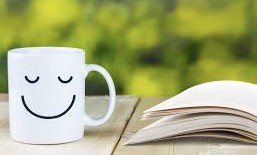 Wellbeing: Coffee, notebook and relaxing wellbeing scene.