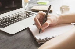 Female writing in a notebook